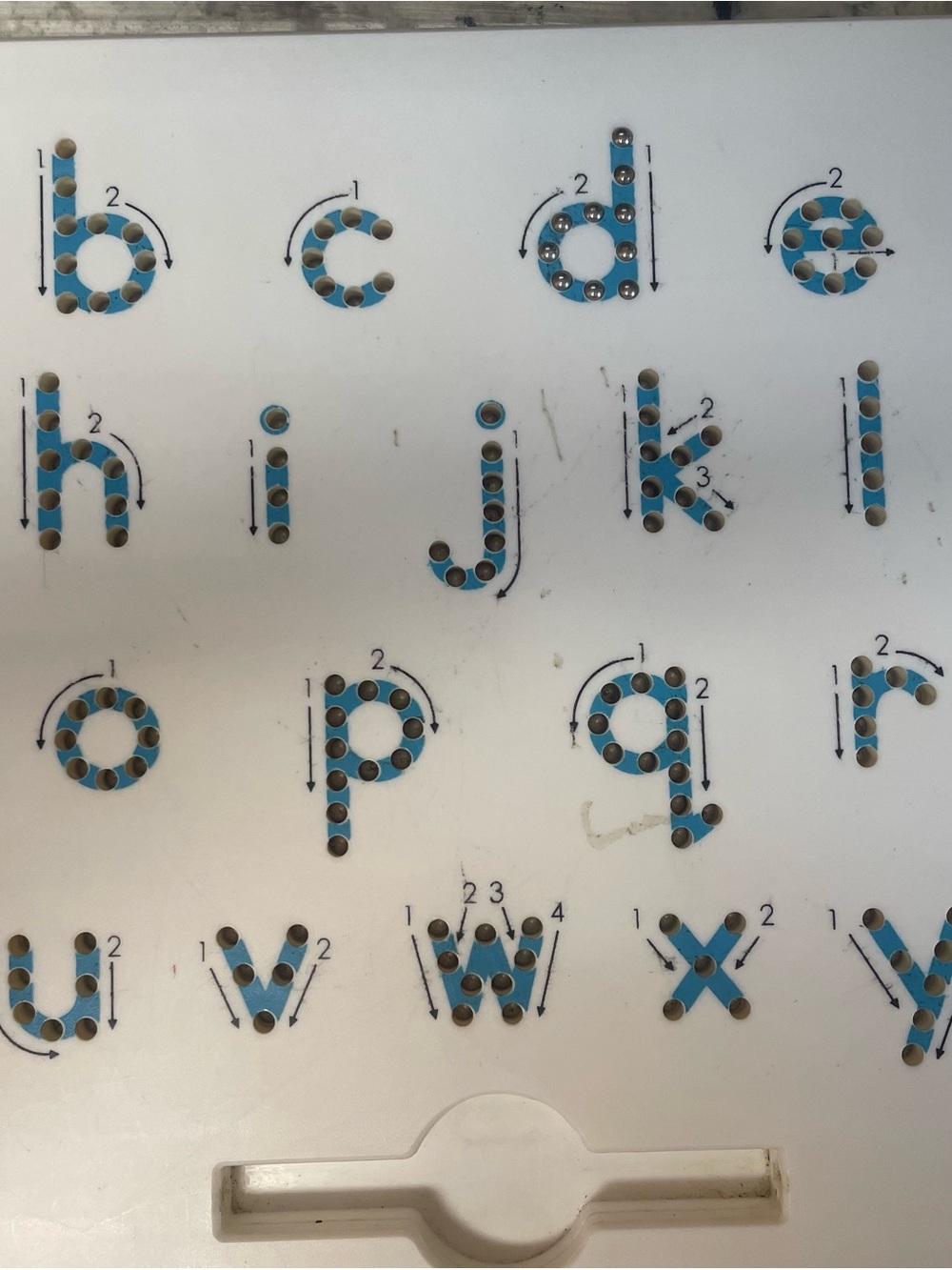 Magnetic ball board to teach/train proper letter formation